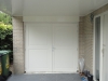 Kozijn met dubbele deuren met panelen in garage Grote Haag Zeewolde